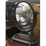 A Victorian mahogany dressing mirror with an oval