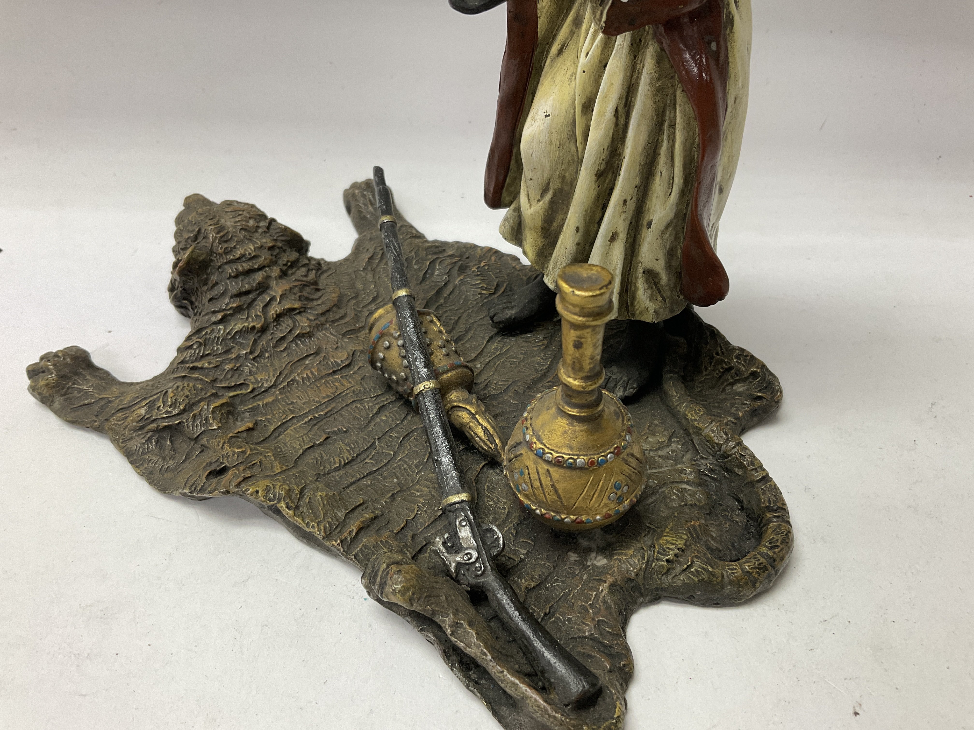 A cold painted bronze Arab figure holding a rams h - Image 3 of 7