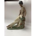 A Lladro terracotta finish figure of a maiden. 34c