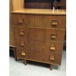 A mid 20th century teak chest of four drawers.