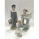Three Lladro figures of boys and girls, tallest ap