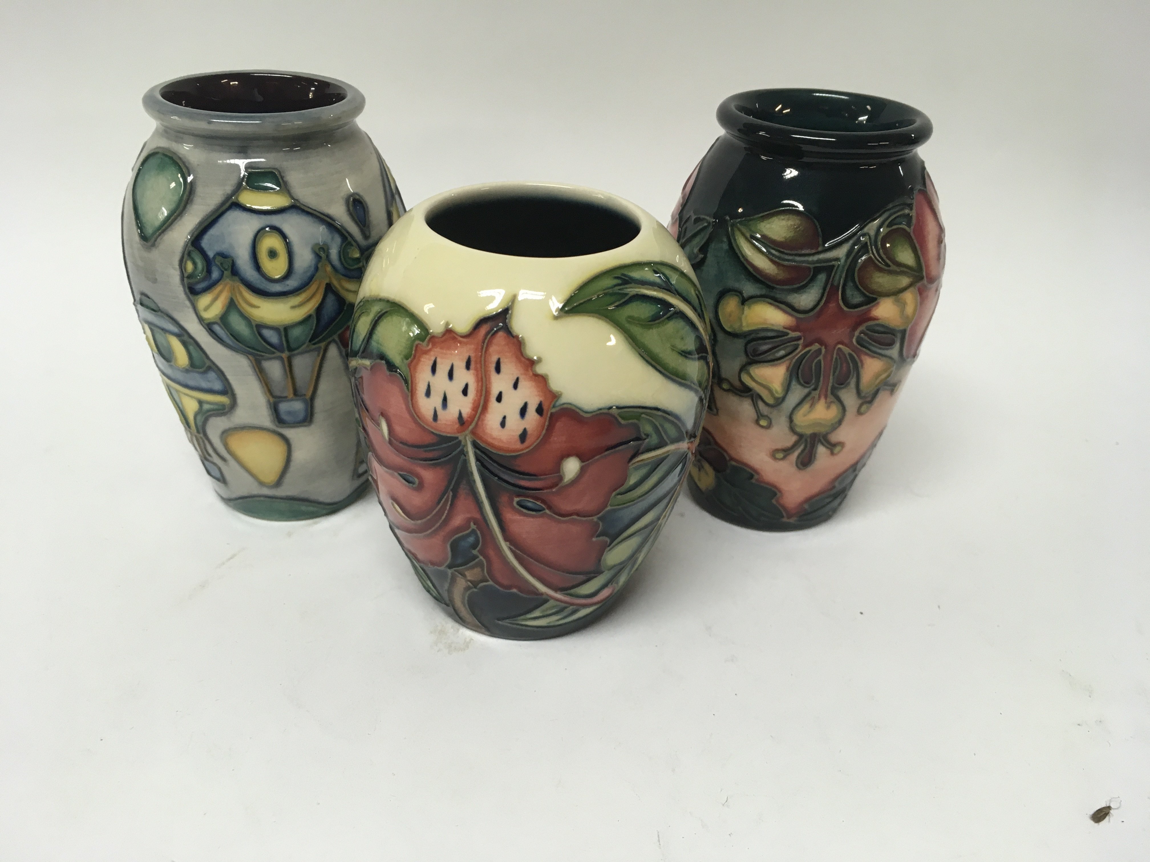 Three Moorcroft vases decorated with flowers and f - Image 2 of 3