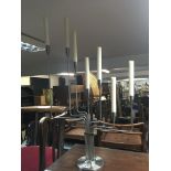 A modern design stainless steel Menorah type candelabra. Height 78cm