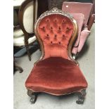 A Victorian carved walnut ladies chair with cabriole legs.