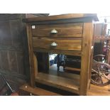 A modern stained solid pine side table with two drawers.