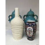 A pair of blue crackleware vases and covers and a