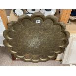 A large 19thC Indian brass tray. 77cm.