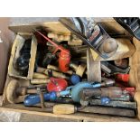 A box of mixed woodworking tools.