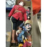 Collection of various vintage puppets and dolls in