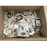 A box of loose cigarette cards.