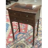 An Edwardian inlaid mahogany side table fitted wit