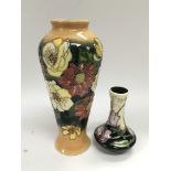Two Moorcroft vases comprising one signed by E Bos