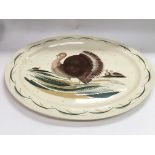 A Susie Cooper meat plate decorated with turkeys,