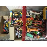 Four boxes of loose playworn die cast vehicles.