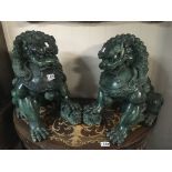 A pair of composition Chinese jade coloured temple dogs Hight 45cm