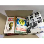 A box of football programs feom the 1960s onwards,