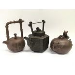 Three terracotta Yixing teapots.