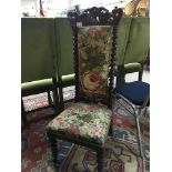 A Victorian walnut prayer chair with a shaped top on barley twist supports. With floral