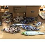 Eight Murano glass fish plus a Murano glass clown