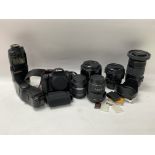 A Canon 77D digital SLR camera body with 5 various