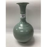 A Chinese fluted bottle vase with crackle glaze fi