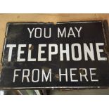 A enamel sign you may telephone from here . 46 cm