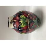 A Moorcroft Pottery vase withHummingbird design by