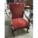 An 18th century style gilt wood open arm chair wit