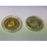 2 commemorative 50 dollar 14k gold coins.