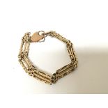 A 9carat gold gate bracelet with padlock clasp wei