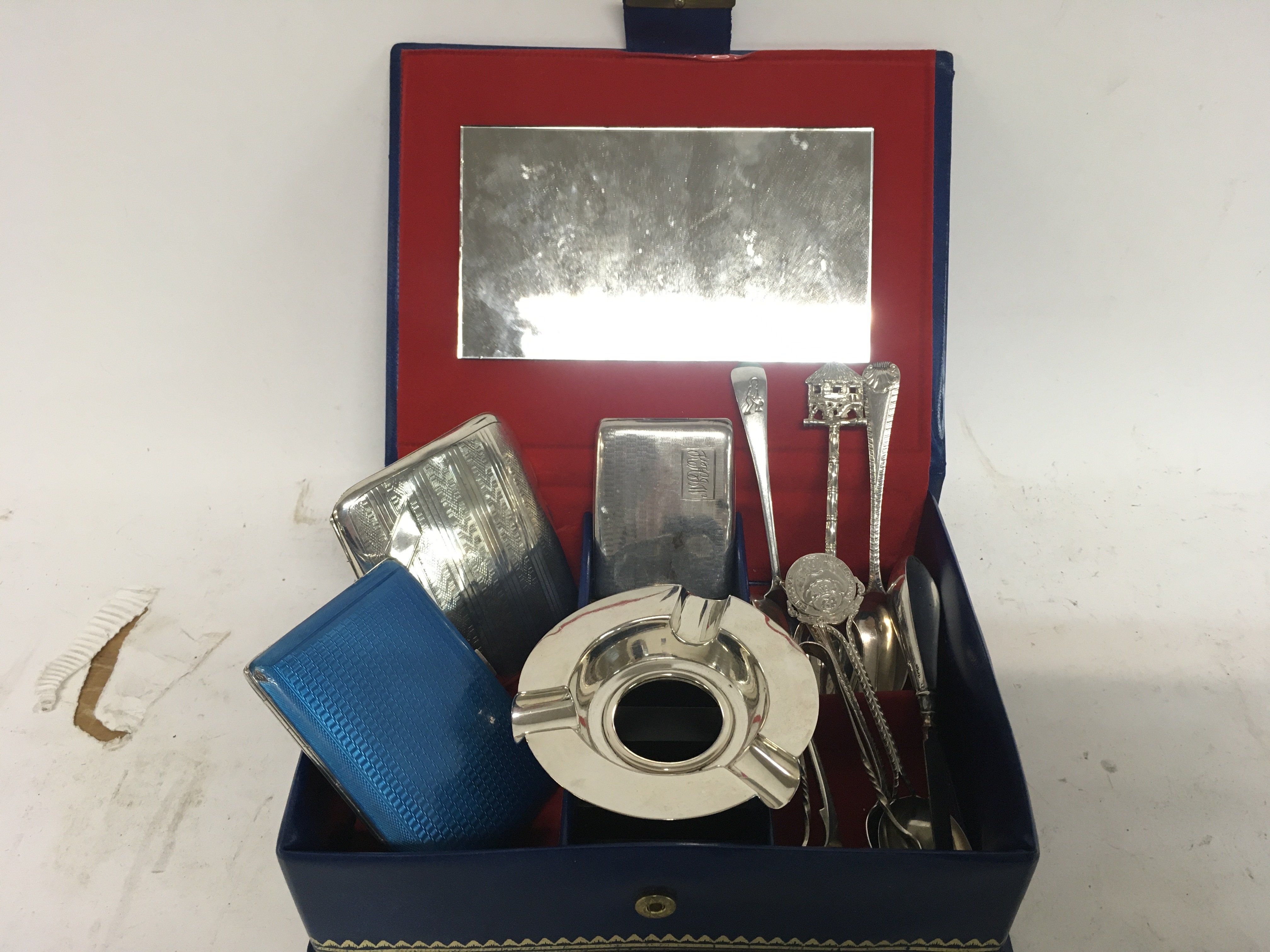 A box of hallmarked silver cigarette cases and oth