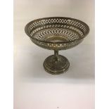 A small silver basket the tapering stem on a circular base Birmingham hallmarks. 128 grams