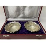 A paid of pressed sterling silver bowls, with case.