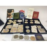 A collection of gold plated collectors coins and o