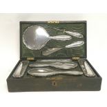 B.S.M Cased silver dressing set featuring a mirror