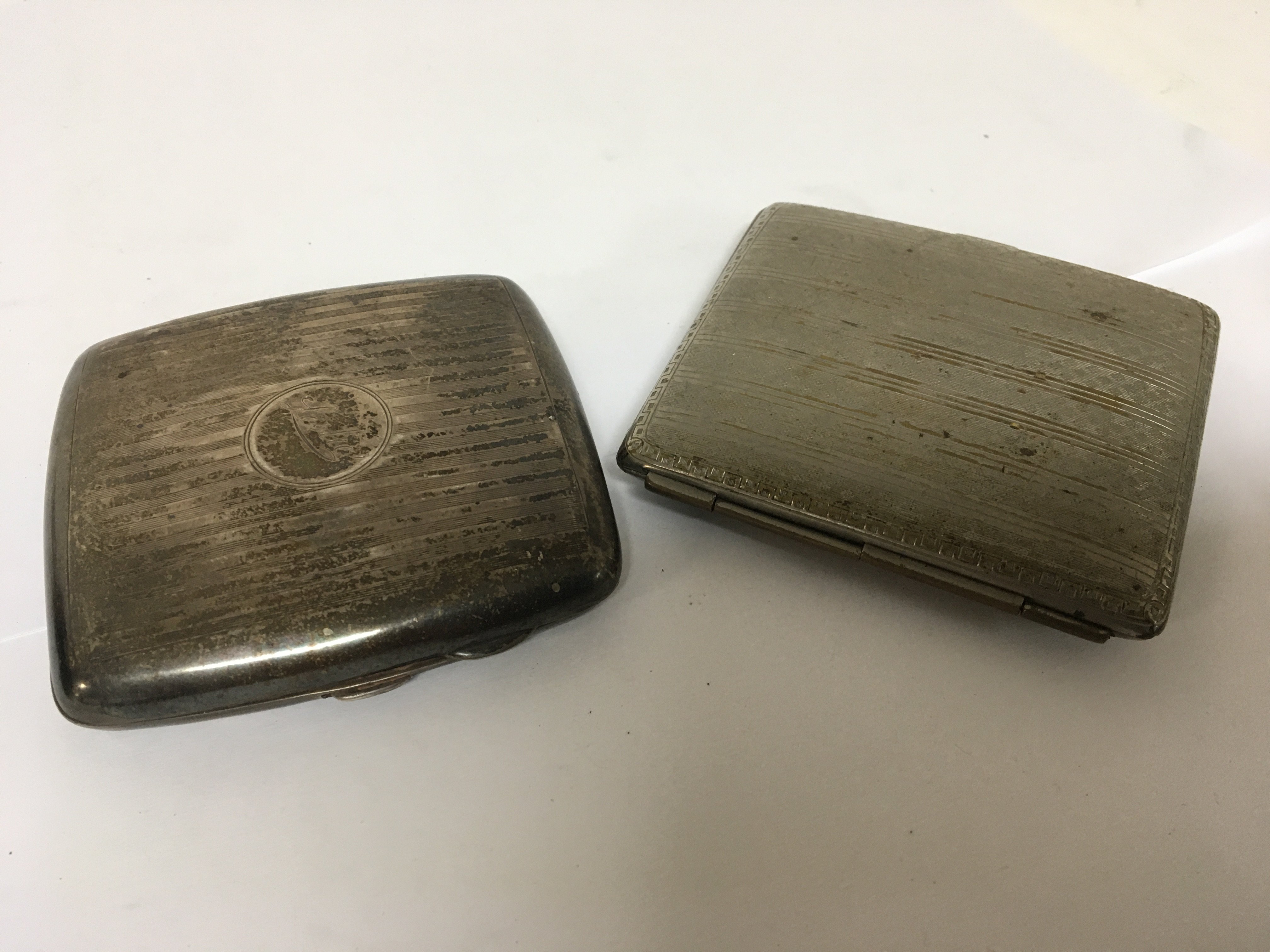 A silver cigarette case weight 84g and one other c