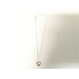 A Tiffany and Co heart pendant and chain by Elsa P