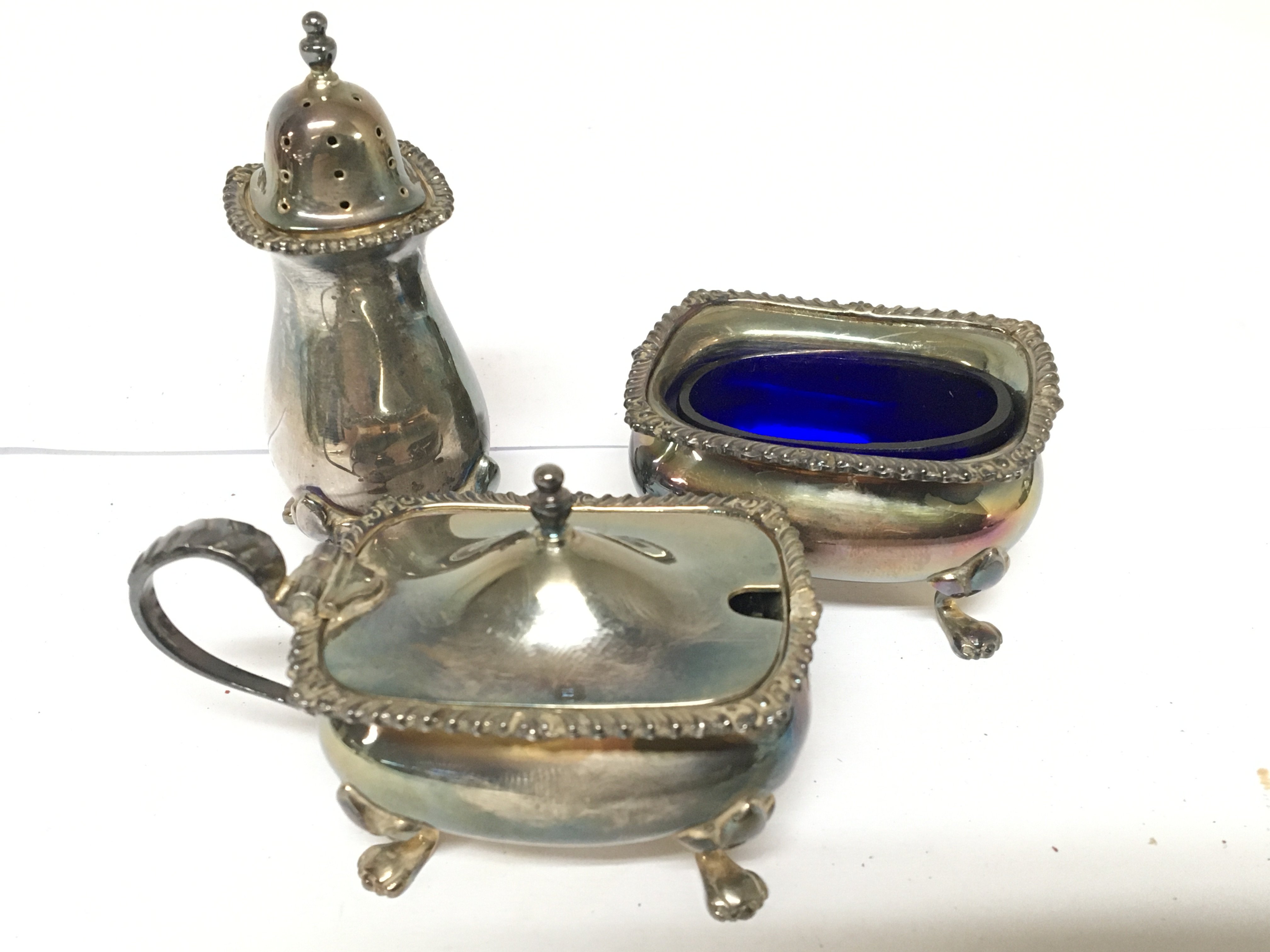 A silver condiment set with blue glass liner Birmi