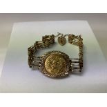 A 1918 half sovereign mounted in 9ct gold gate bracelet.