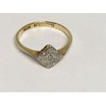 A 18 ct gold ring of Art Deco design inset with di