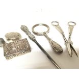 A pair of silver grape scissors and other silver o