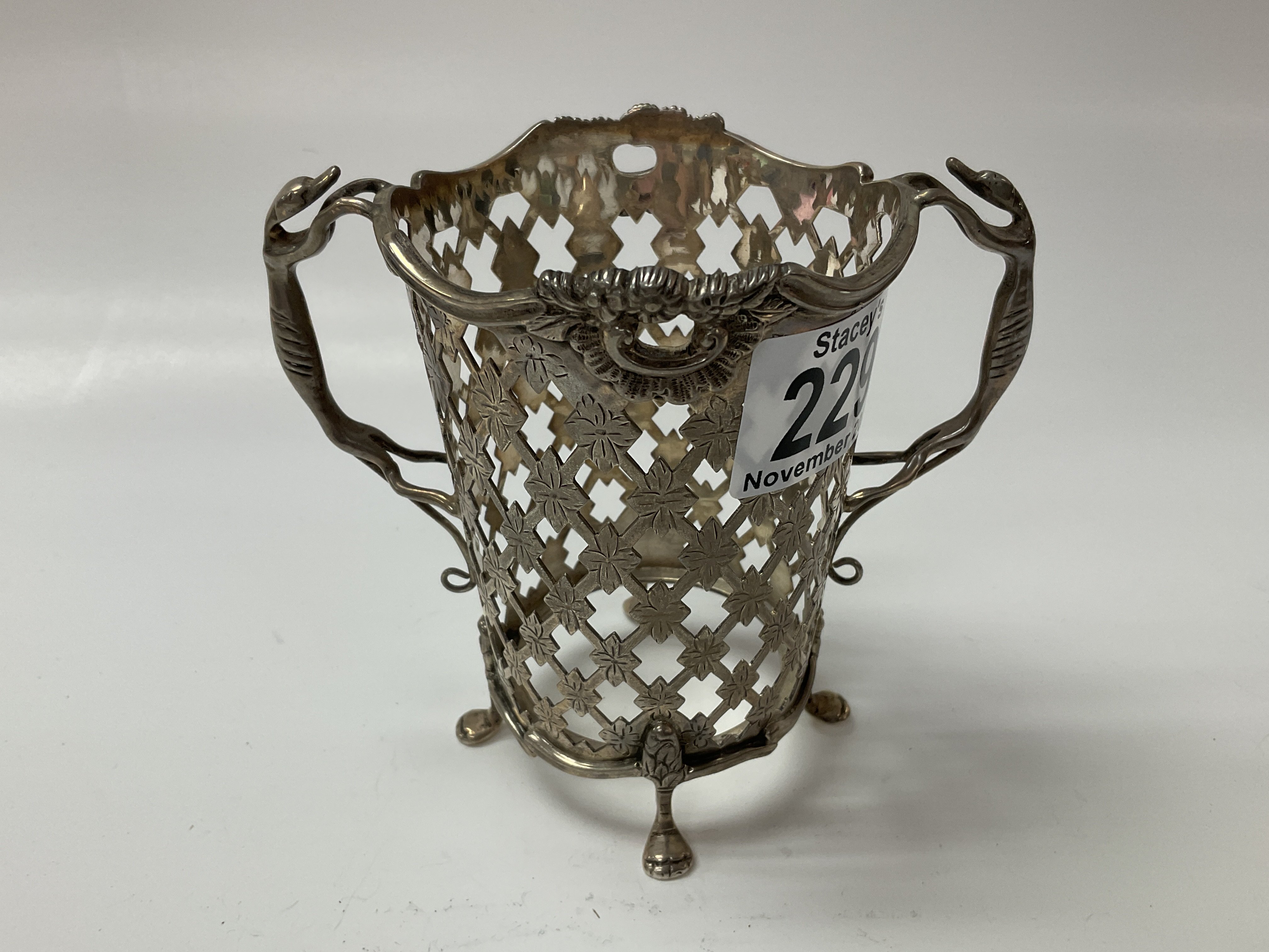 A hallmarked silver basket with greyhound handles.