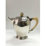A silver coffee pot, Sheffield 1938. Approx 623g.
