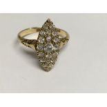 A 18 ct gold cluster ring inset with diamonds size