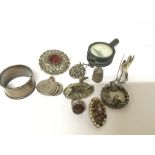 A Scottish brooch a silver napkin ring small compa