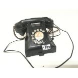 A Vintage black bakelite phone.