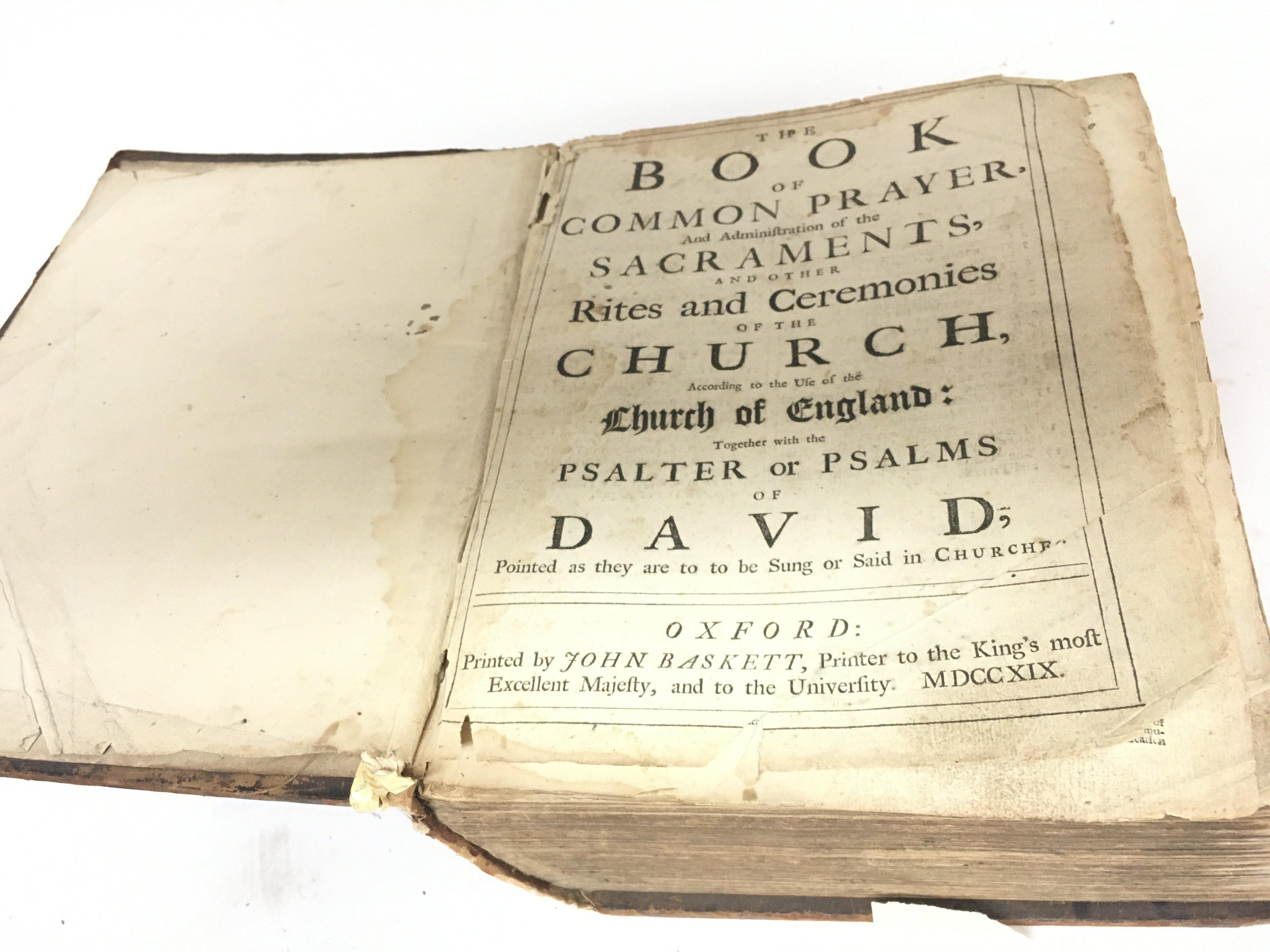 An antique early 18th century bible printed by John Baskett 1719