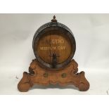 Very good wooden sherry barrel with tap on stand