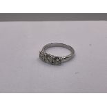 A certified 18ct white gold diamond trilogy ring,