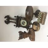 A carved hard Wood Indonesian bust a barometer and